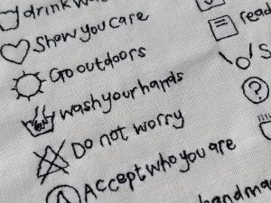 Embroidered care instructions artwork